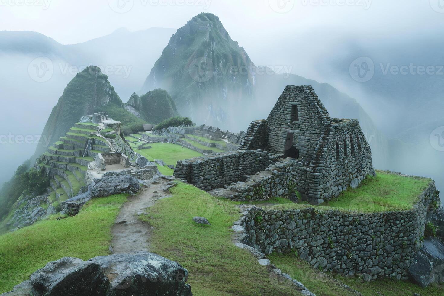Machu Picchu ruins emerging from the morning mist in Peru photo