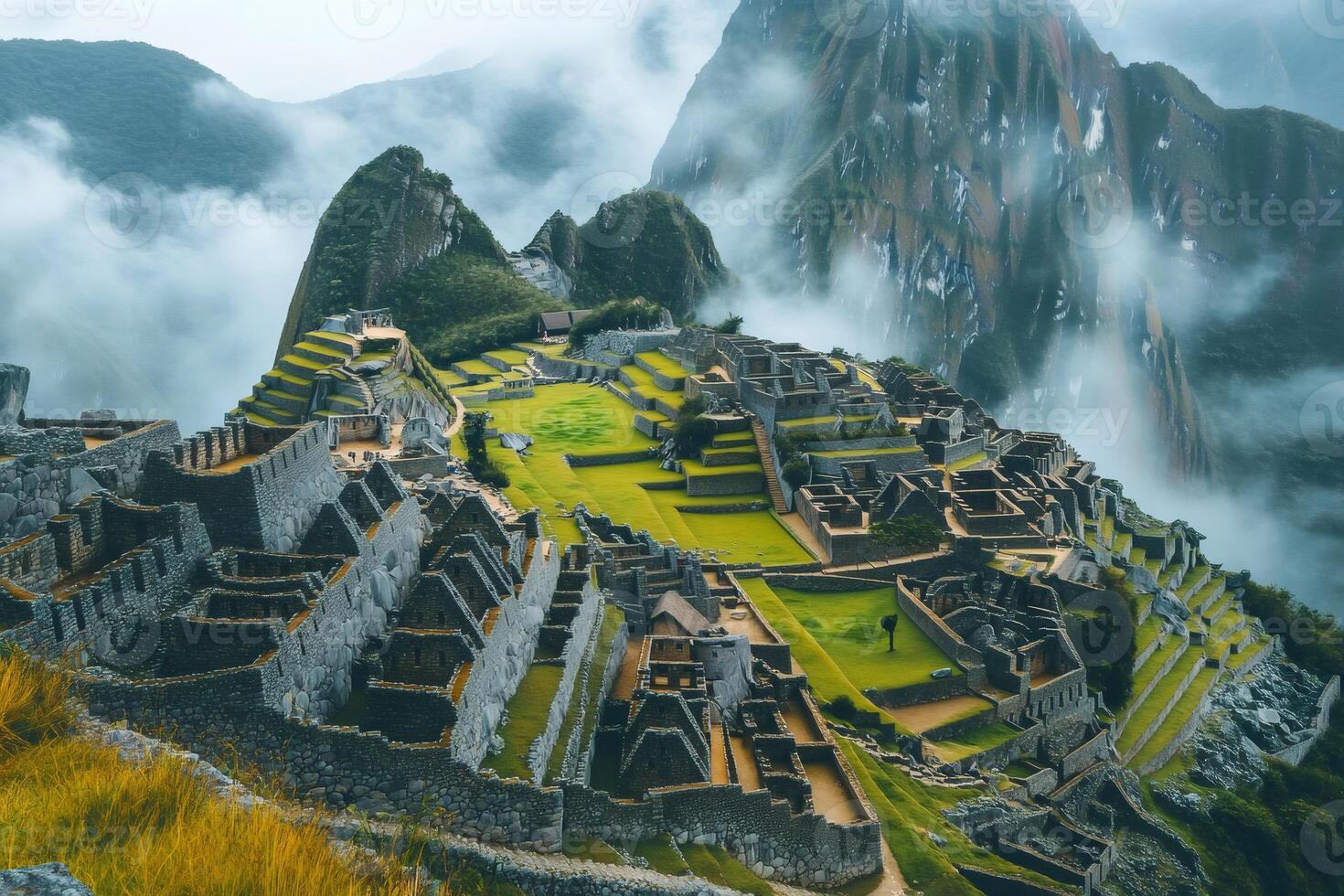 Machu Picchu emerging from the morning mist in the Andes Mountains photo