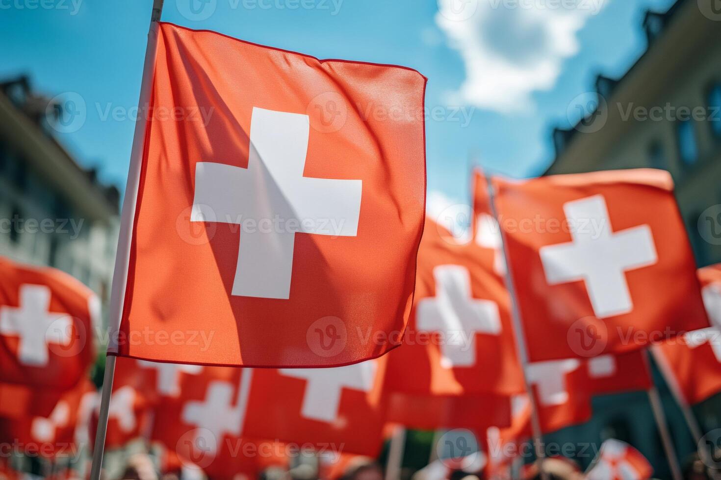 Swiss flags waving in the wind during a celebration in Switzerland photo