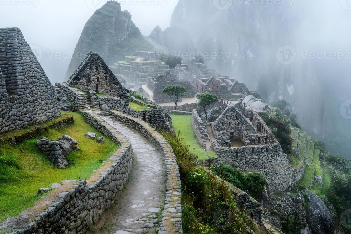 Machu Picchu ruins emerging from the fog in a rainy day. photo