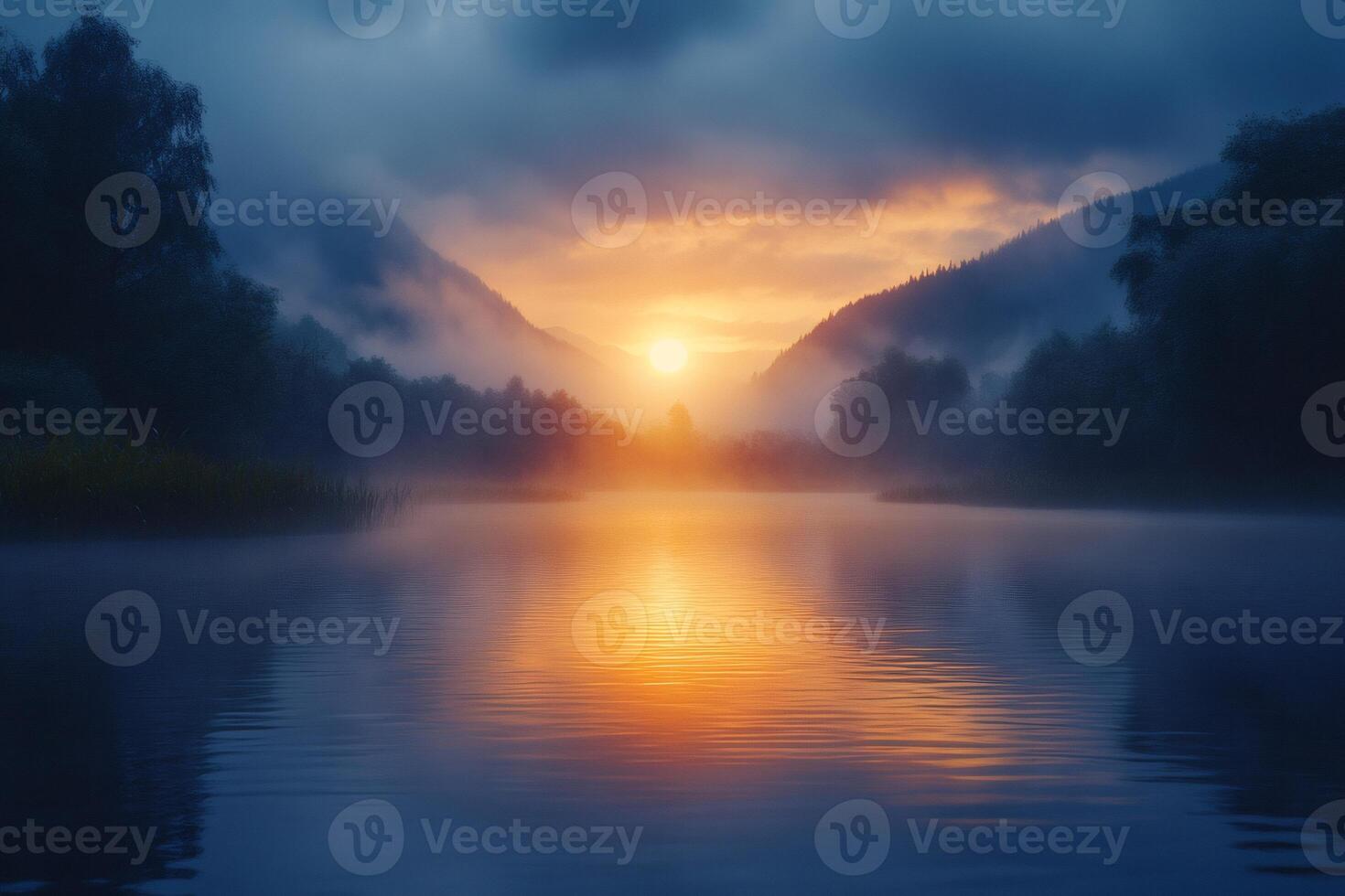 Foggy sunrise creating golden reflections on lake surface photo