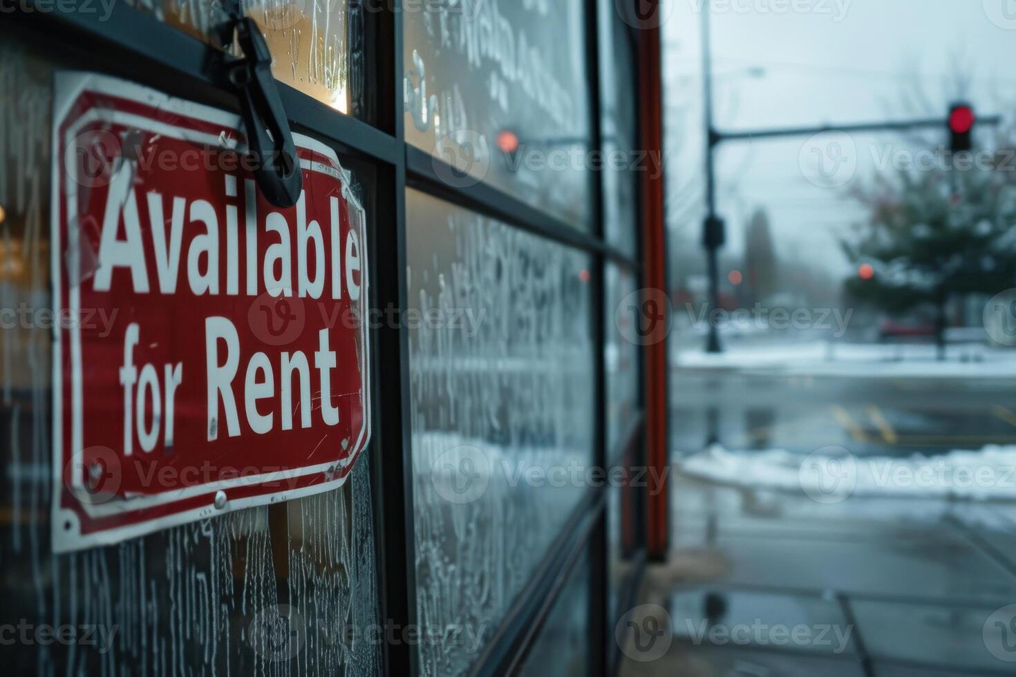 red Available for Rent sign on a glass storefront photo