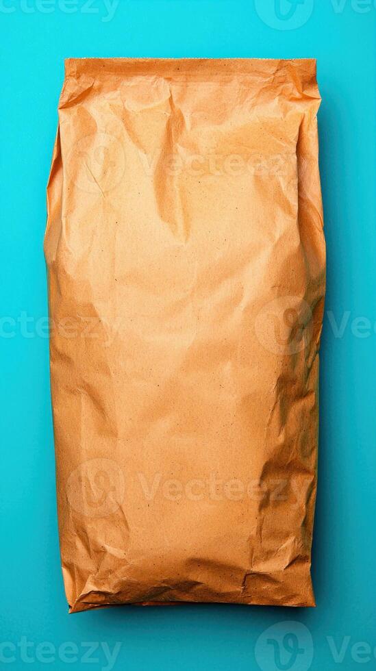A brown paper bag package on a vibrant blue background for various uses. photo