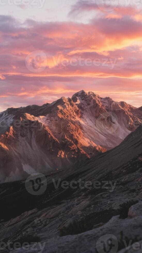 Mountains at sunset with pink clouds photo