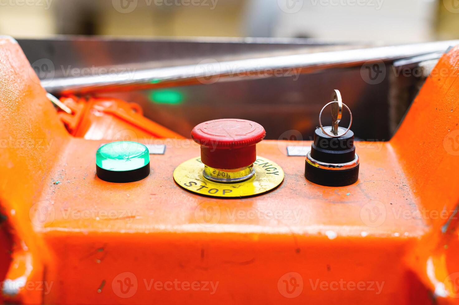 A red Emergency STOP button used for safety on industrial equipment, machine machinery electrical system emergency shutdown mechanism, nuclear power plant, factory, workers safety security concept photo