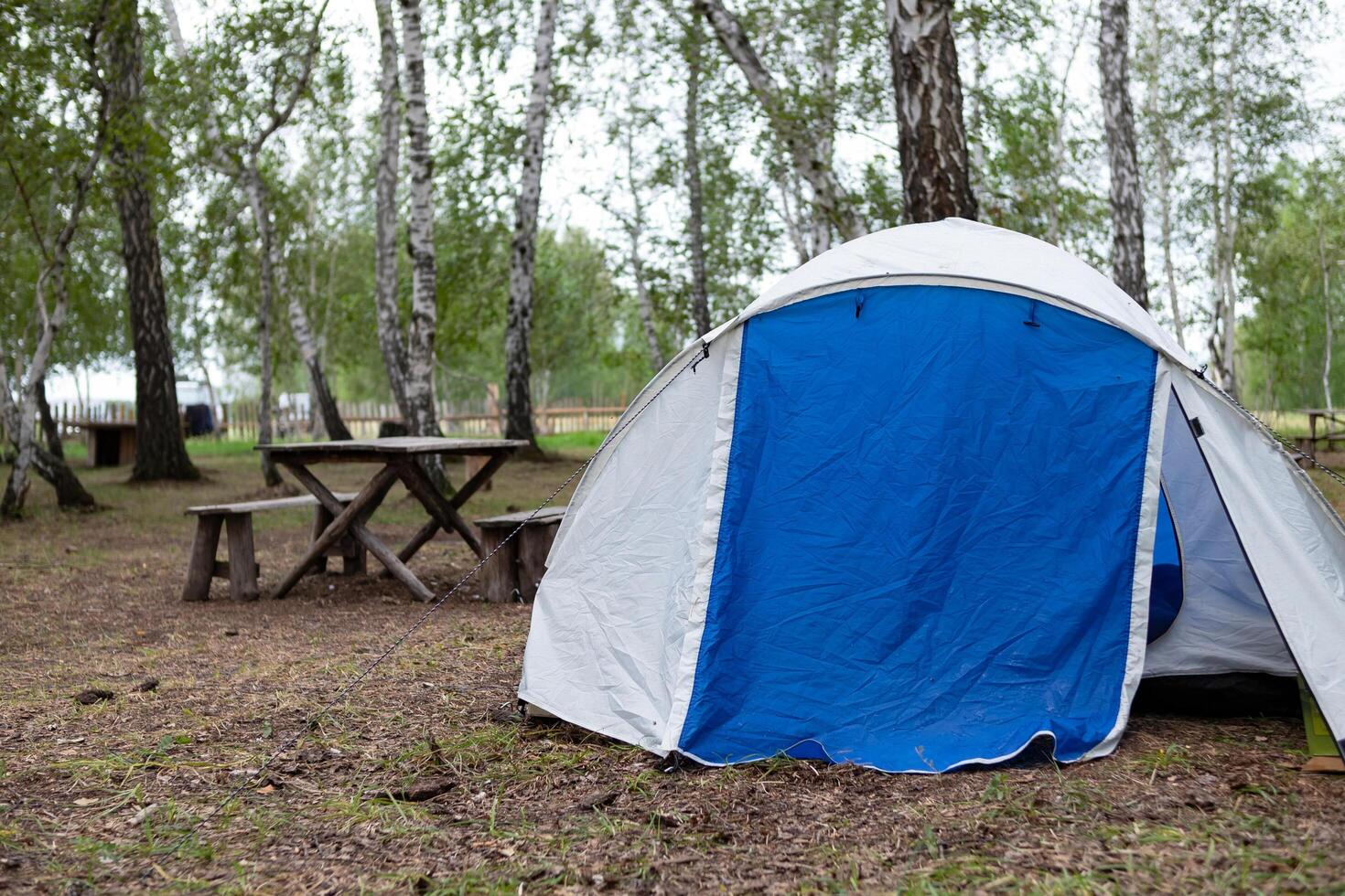 A woman sets up a tent photo