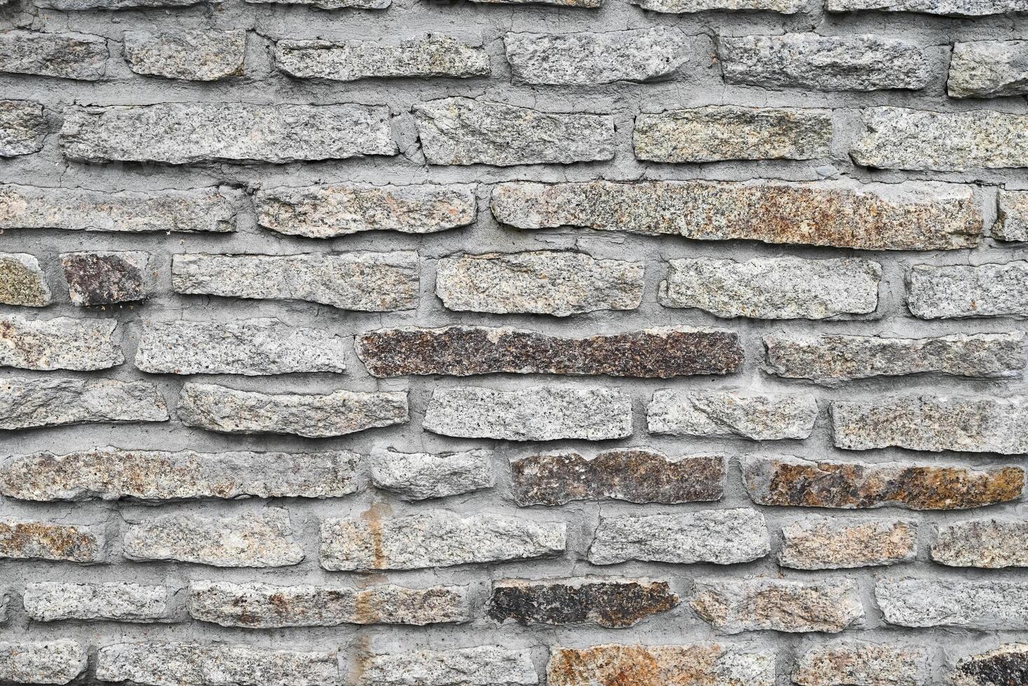 Gray grunge banner. Abstract stone background On a sunny day. The texture of the stone wall. Close-up. Light gray rock backdrop. photo