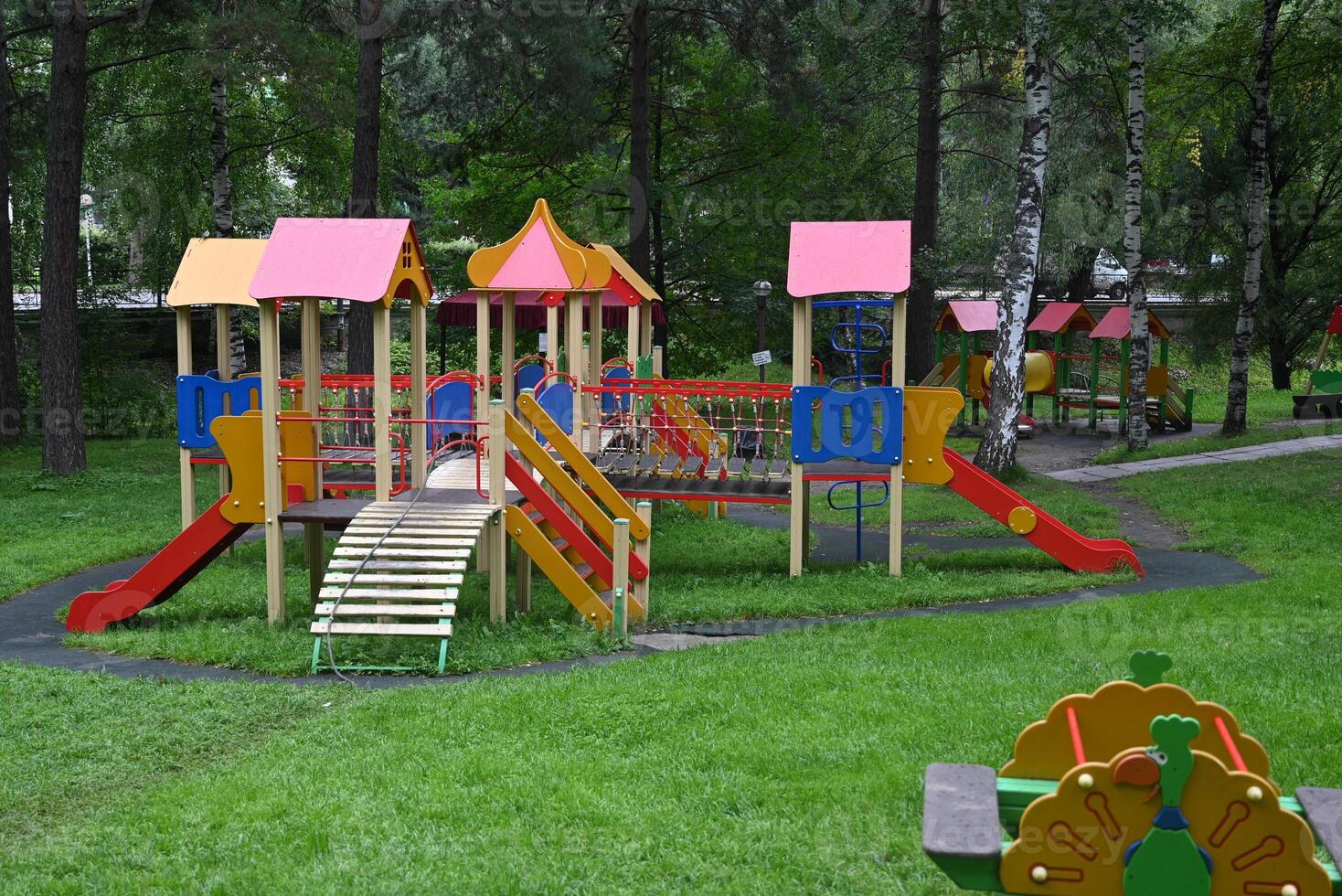 An image of a colorful playground, without children On a sunny, beautiful day. photo