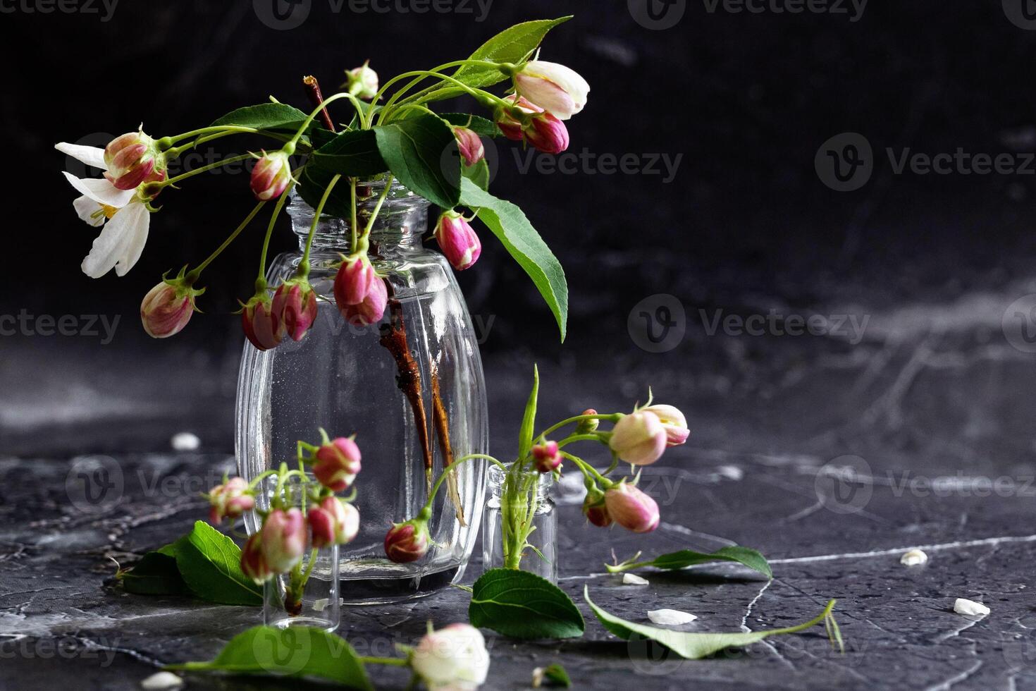Floral layout on a vintage white wooden On a sunny day background and computer partially. Spring flowers, woman freelancing concept. View from above. photo
