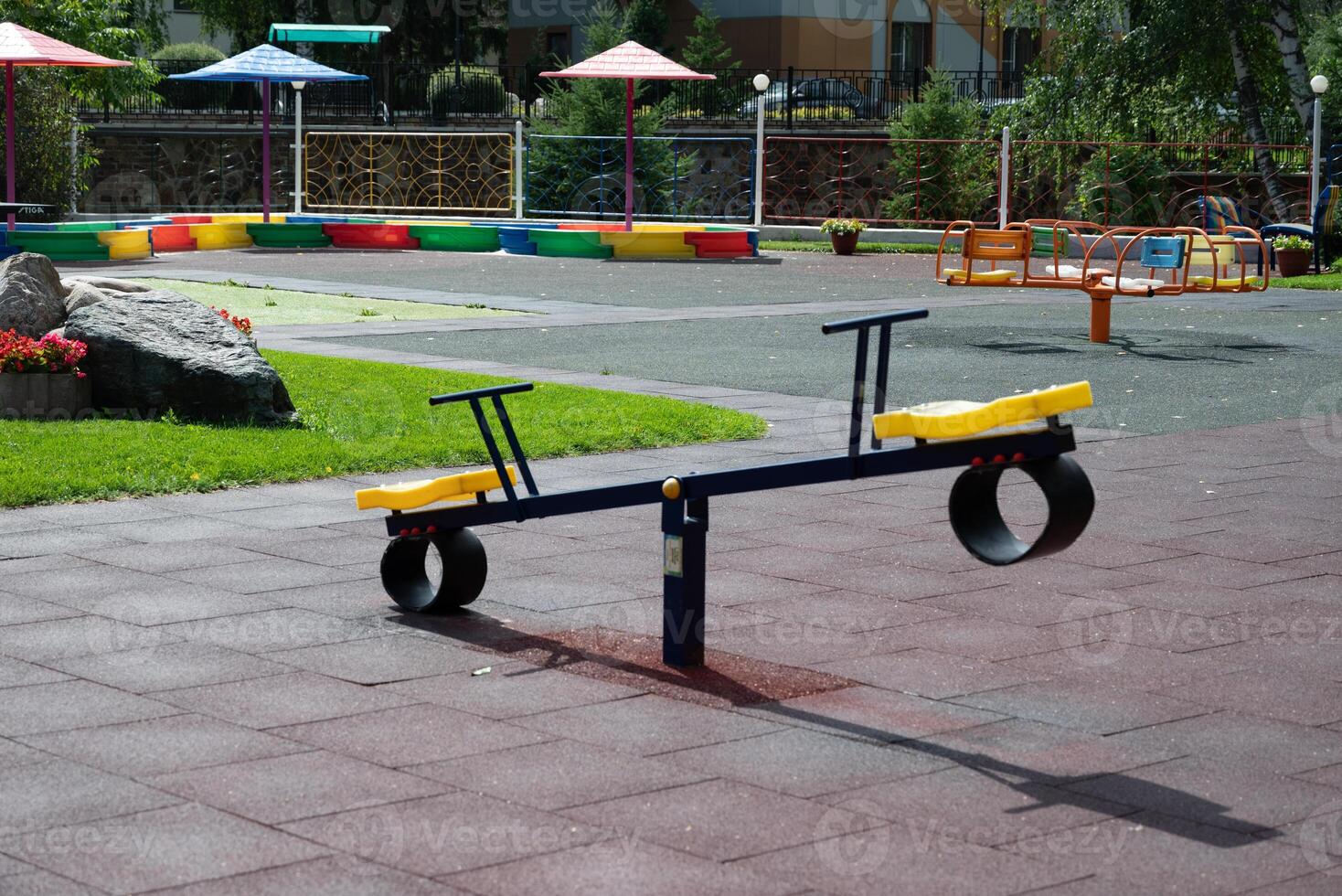 An image of a colorful playground, without children On a sunny, beautiful day photo