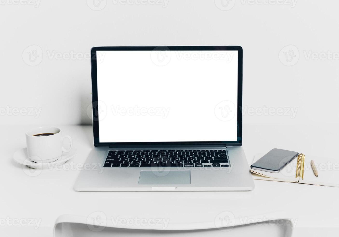 Close up shot of working table with gadget and supplies photo