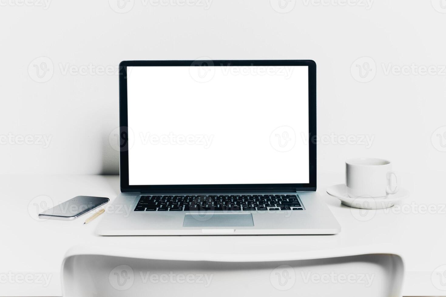 Front view of modern workplace in office with computer and supplies photo
