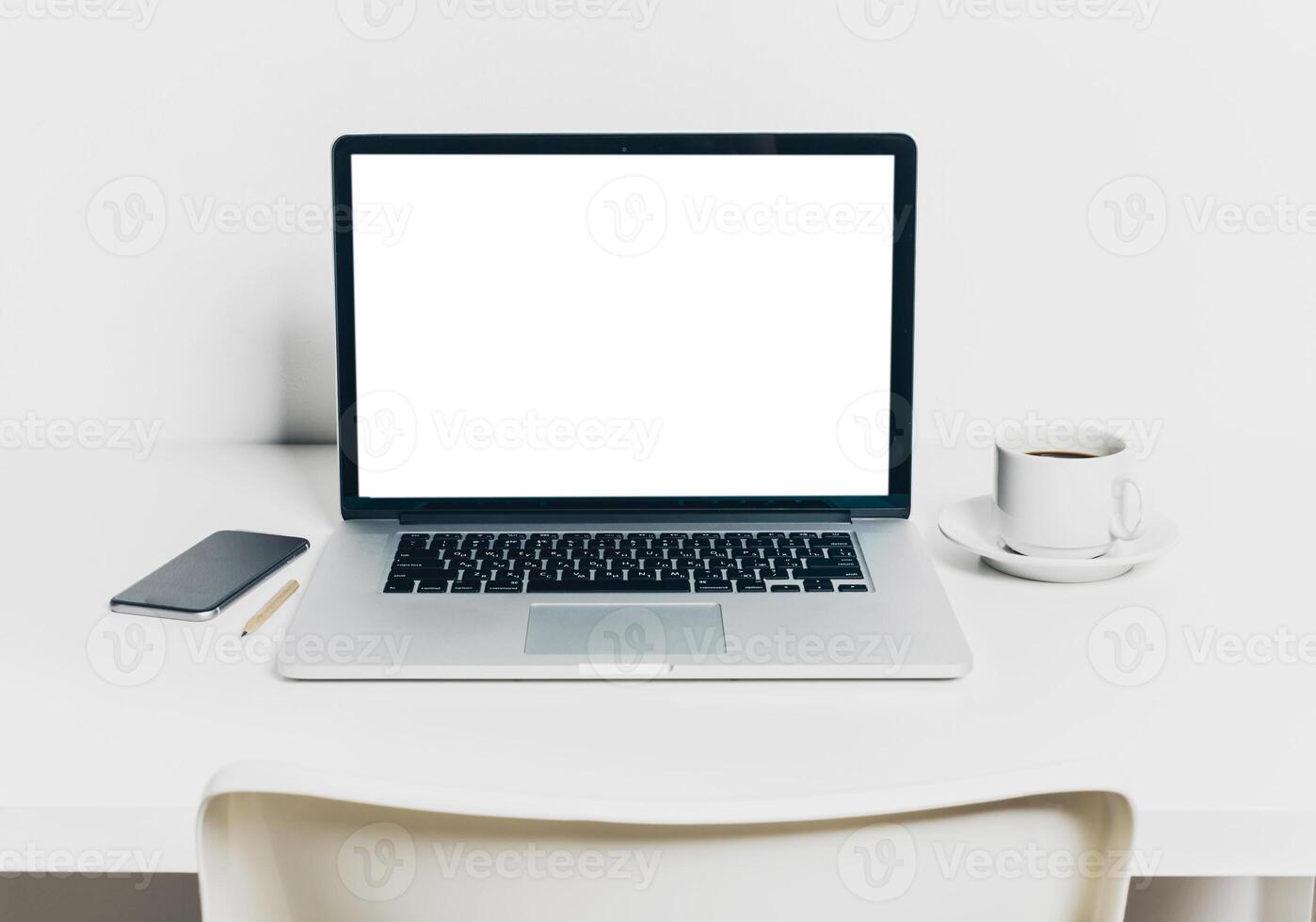 Front view of modern workplace in office with computer and supplies photo