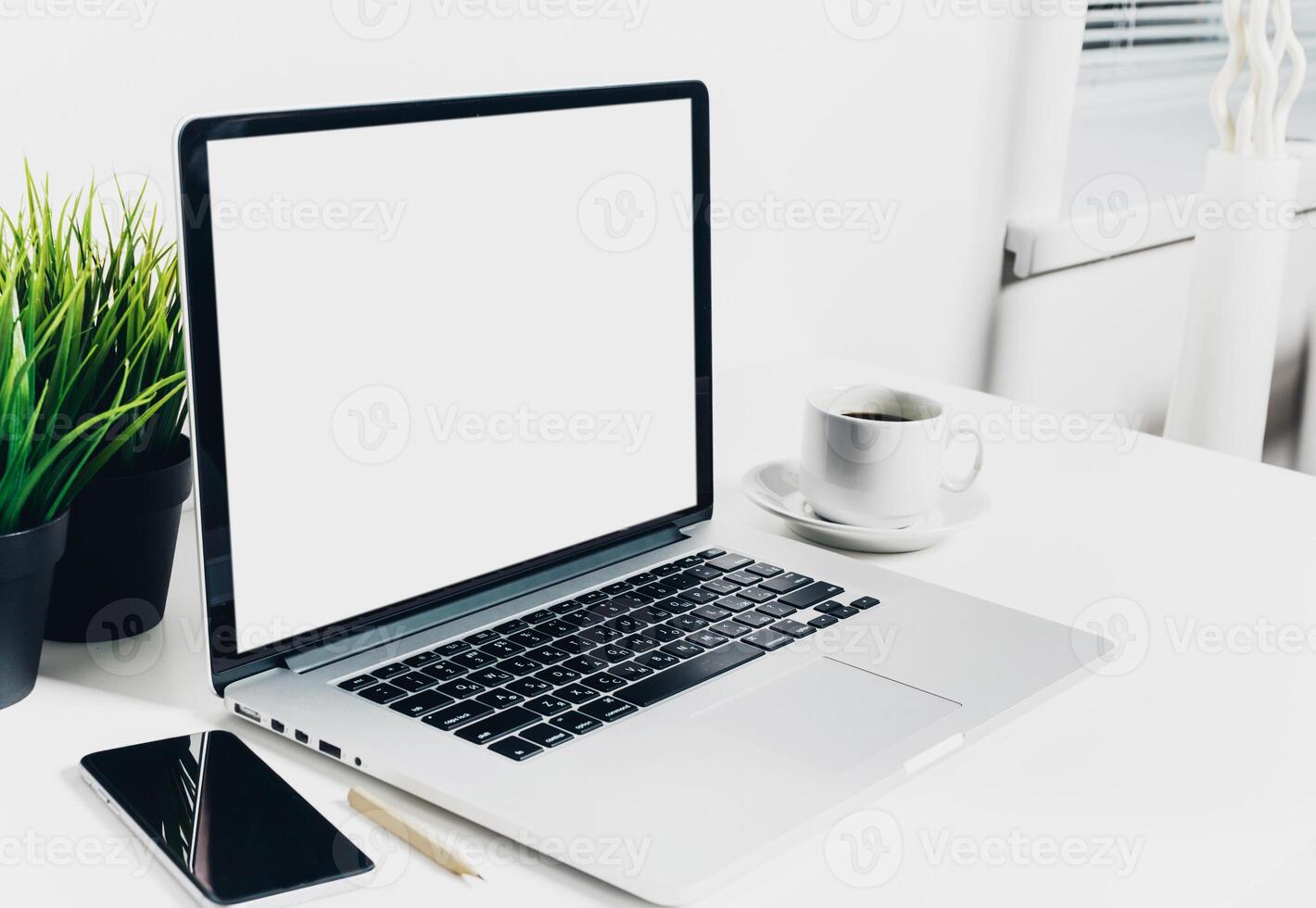 Front view of modern workplace in office with computer and supplies photo