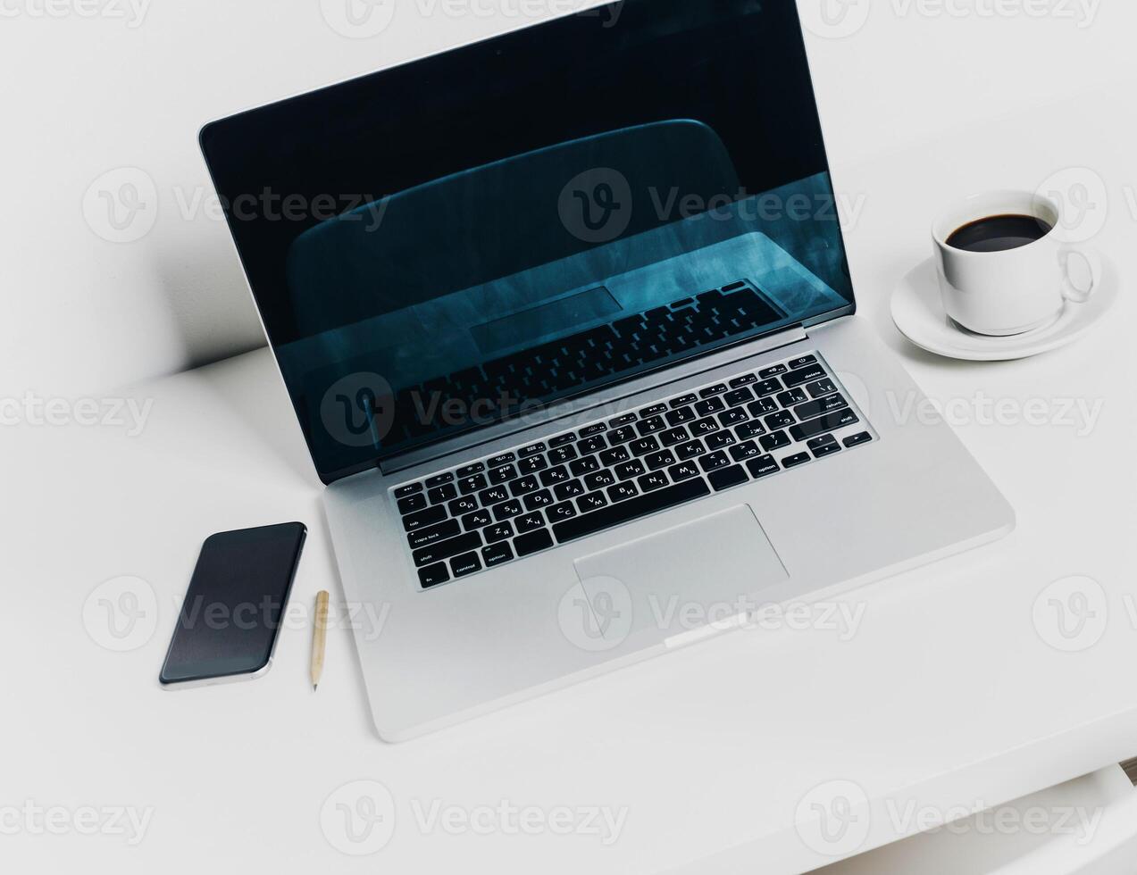 Front view of modern workplace in office with computer and supplies photo