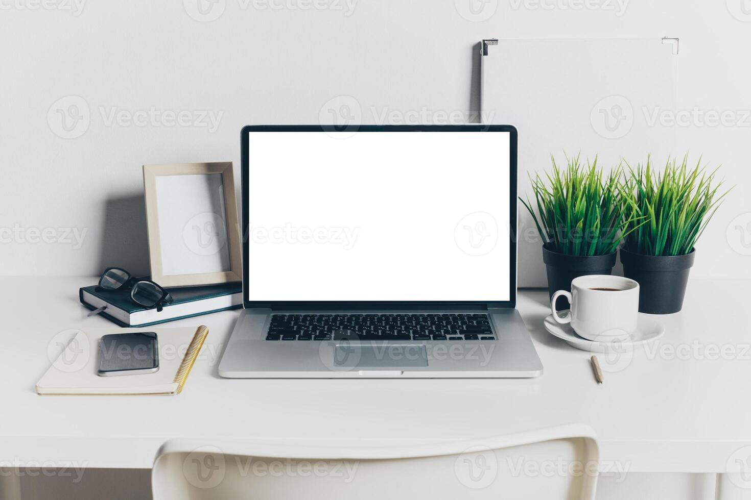 Front view of modern workplace in office with computer and supplies photo