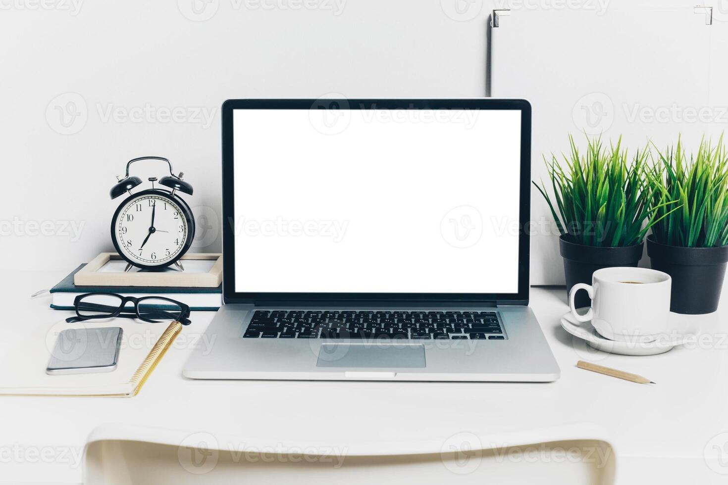Front view of modern workplace in office with computer and supplies photo