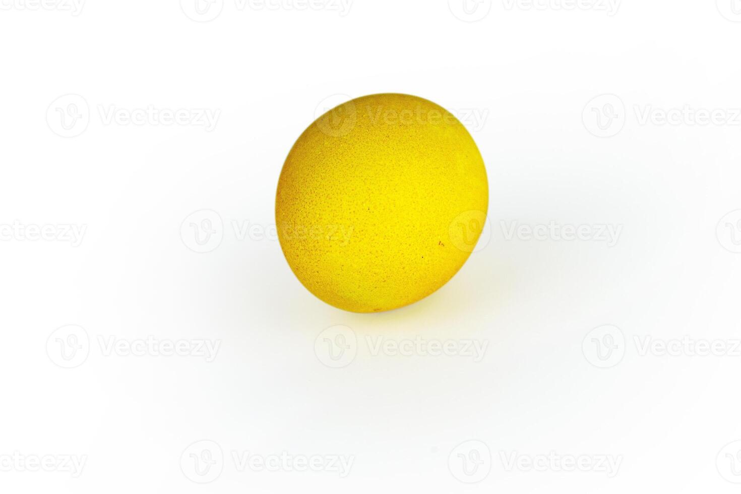 Vibrant yellow easter egg with glowing shell pattern, isolated on white background. Color contrast, creativity, holiday decoration, creativity, symbolism of rebirth. Copy space. Selective focus photo