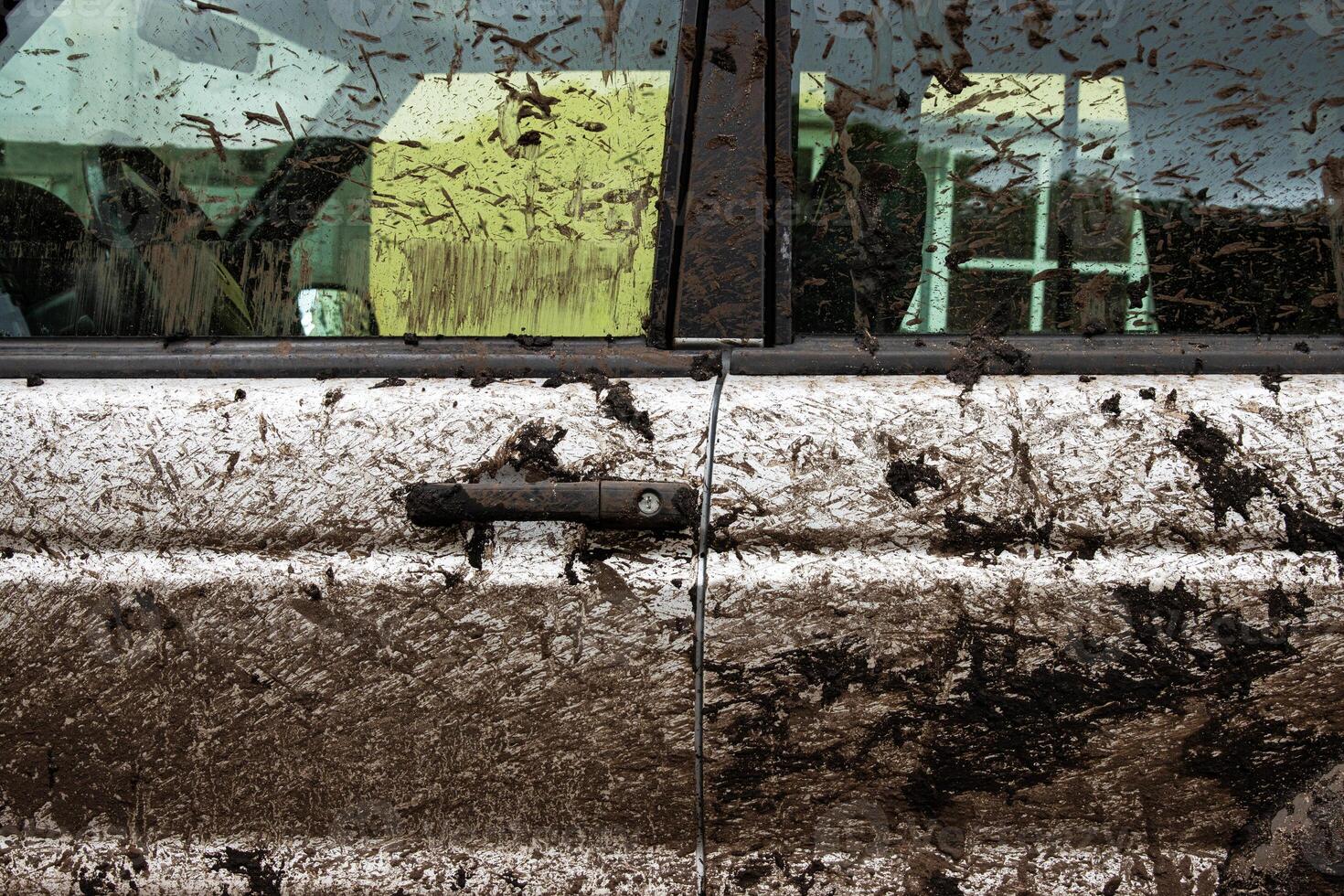 Dirty 4x4 vehicle with mud splatters on body, windows, wheels, tires. Dirty offroad suv car covered in dirt. Rugged terrain adventure, extreme driving, four wheel drive challenges 6 photo