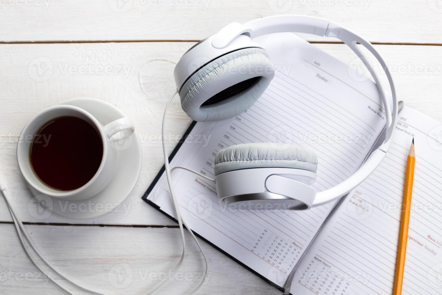 White wooden table with gadgets, view from above photo