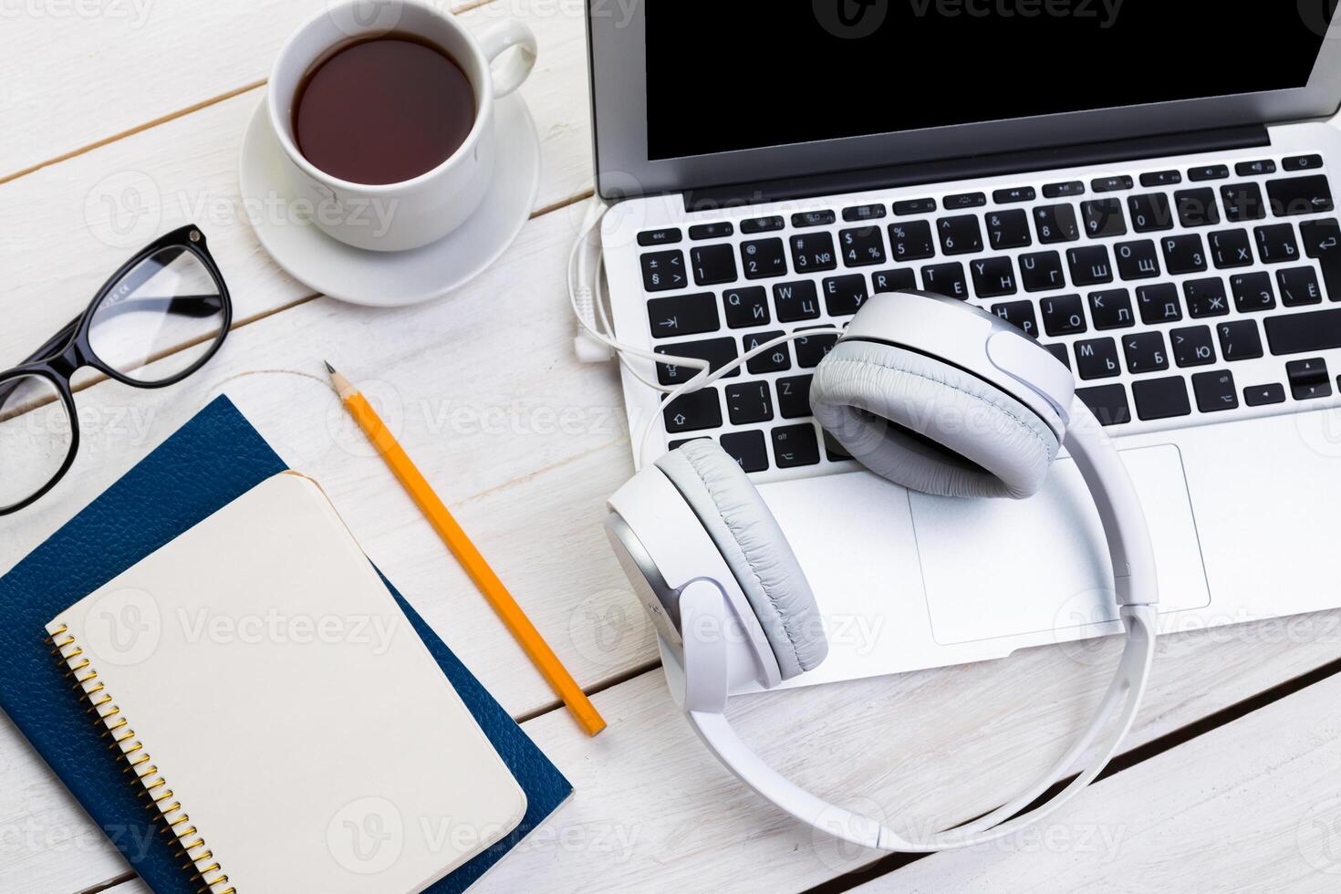 White wooden table with gadgets, view from above photo