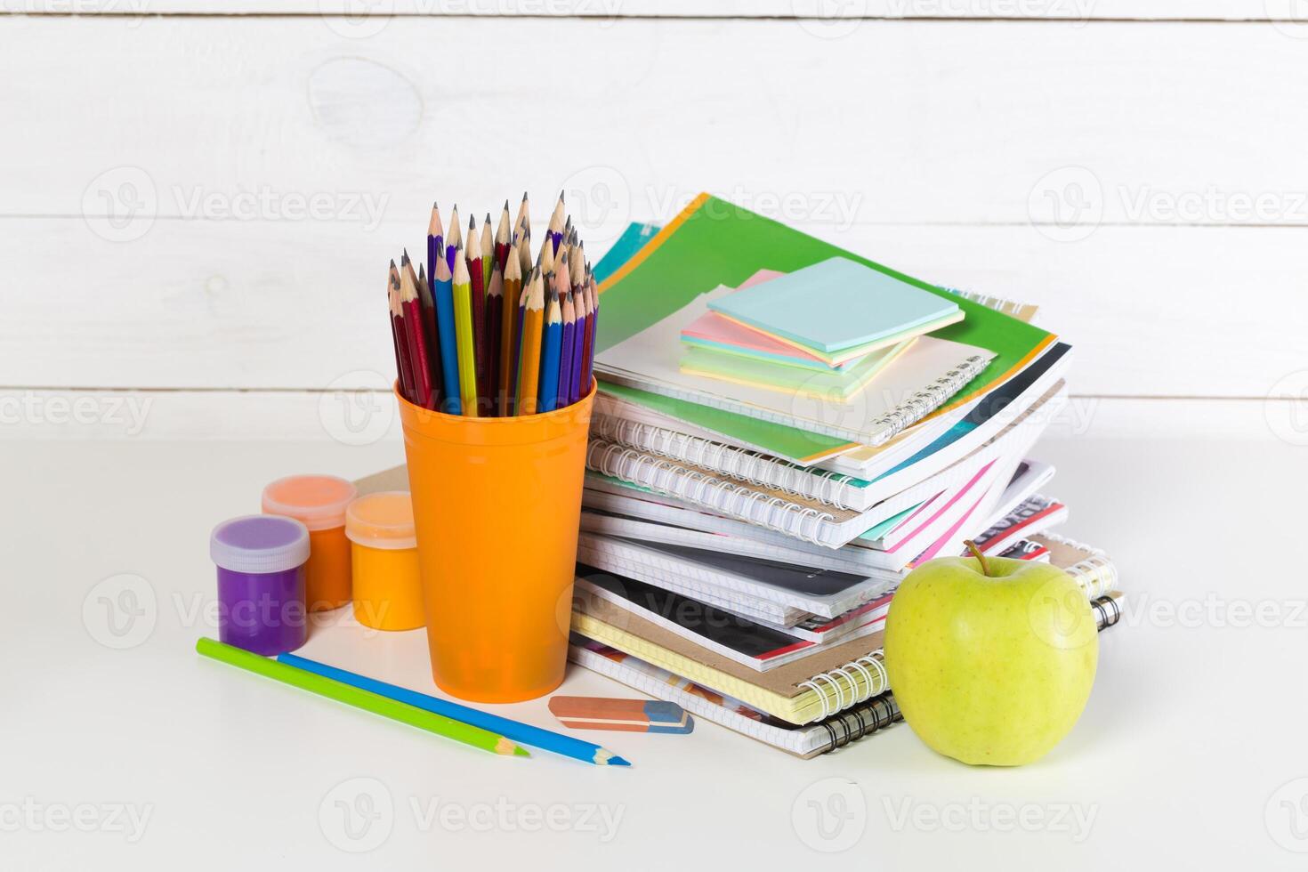 Front view of school supplies on white background photo
