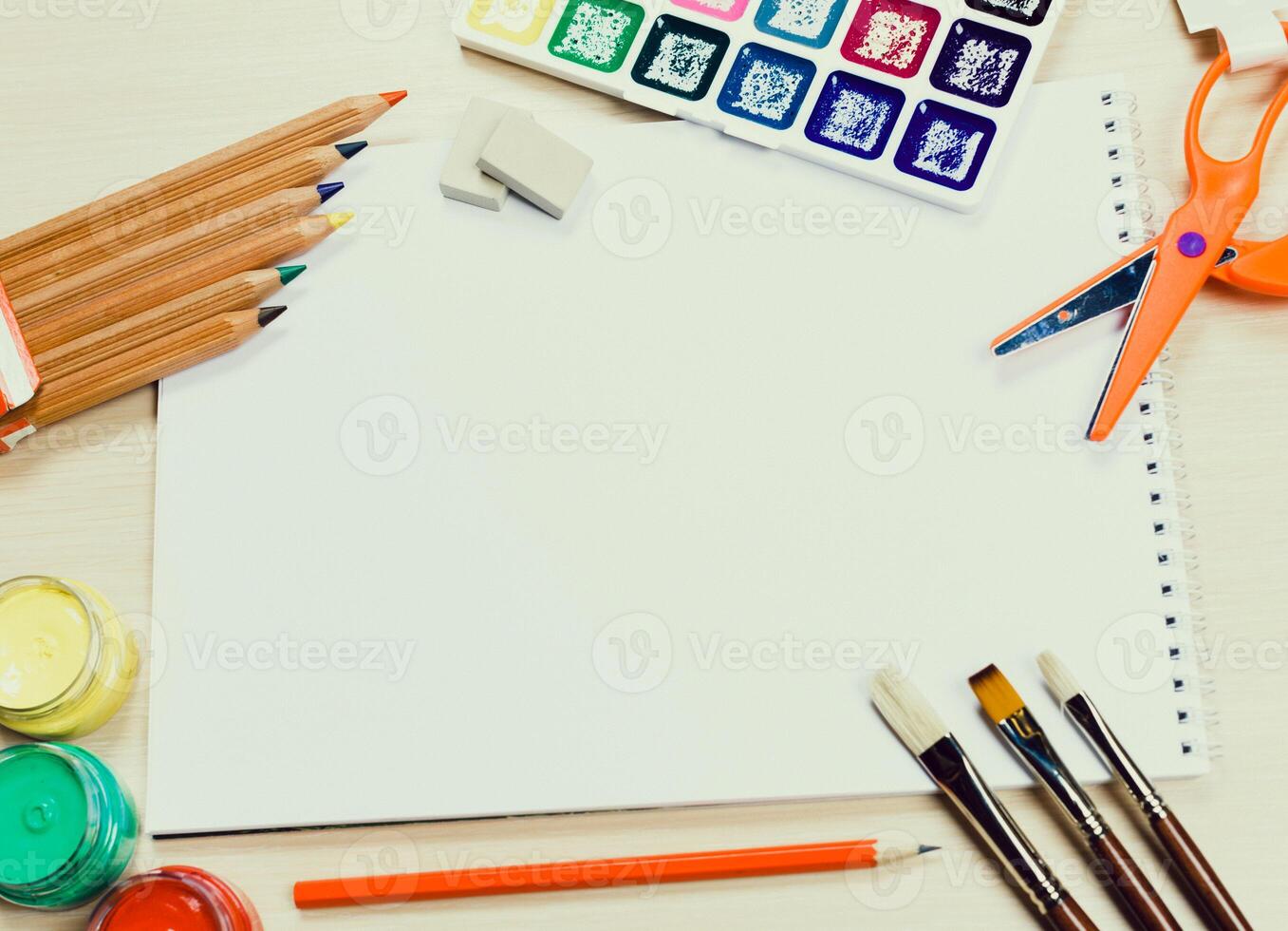 Art supplies arranged on a desk for creative activities during an afternoon craft session photo