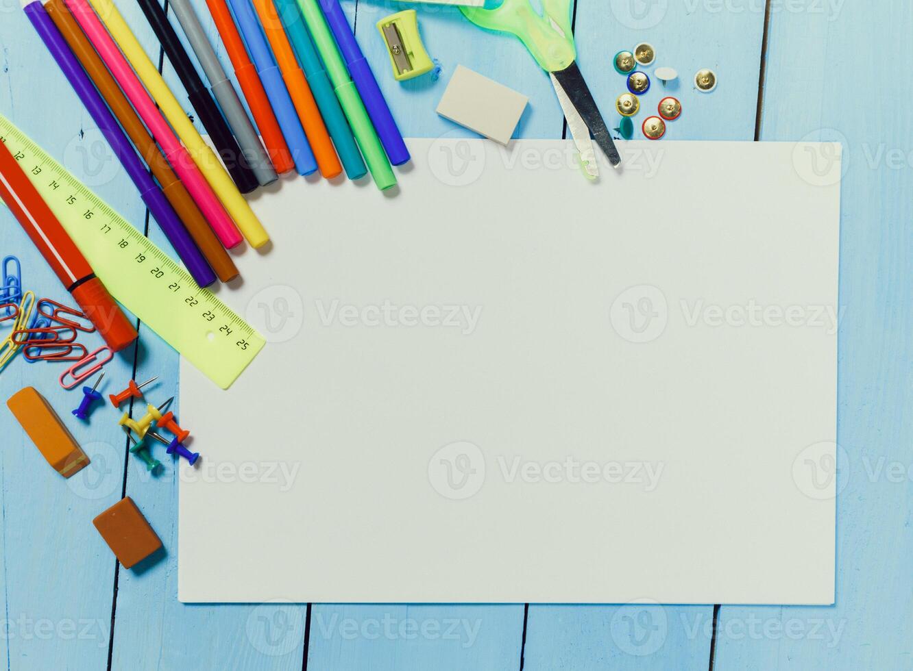 Creative workspace with colorful stationery and blank paper for art projects at home photo
