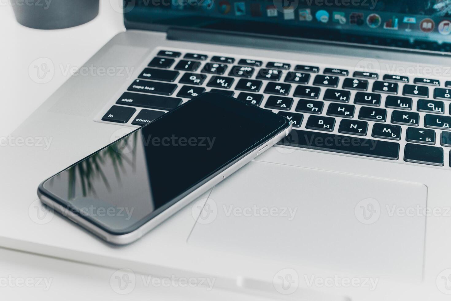 Close up shot of working table with gadget and supplies photo