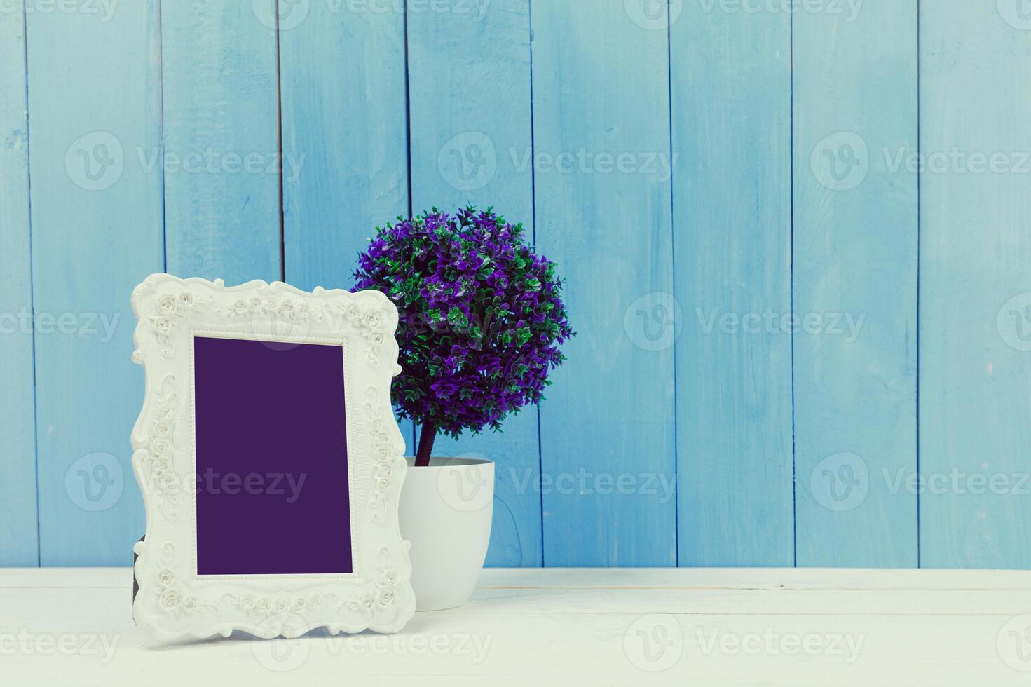 Wooden items of home decor close up on blue wooden background photo