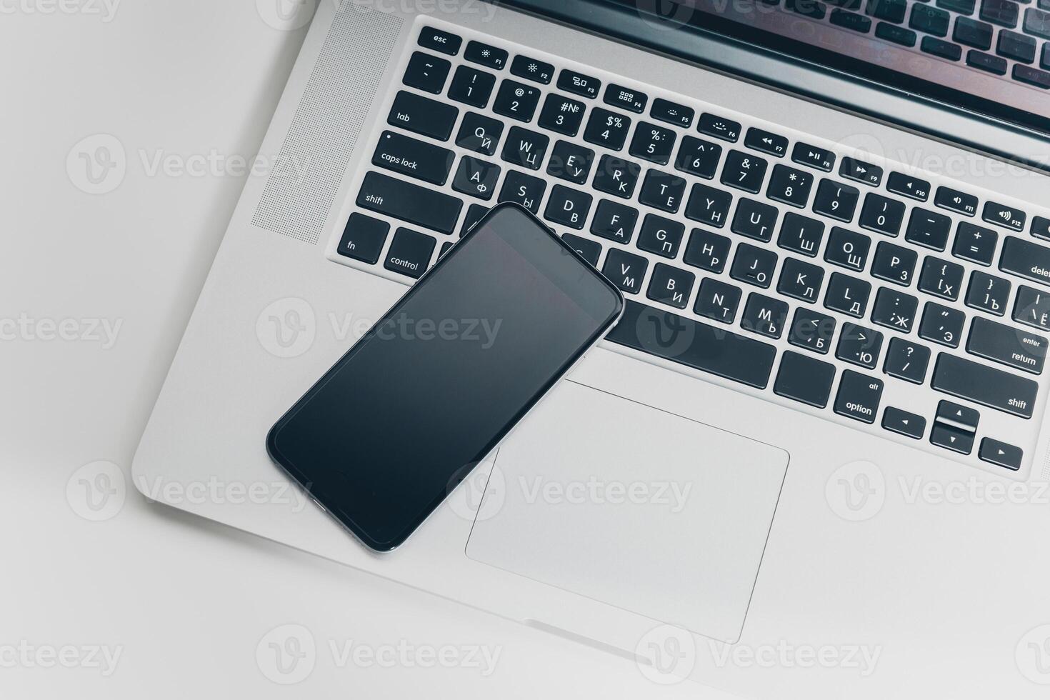 Close up shot of working table with gadget and supplies photo