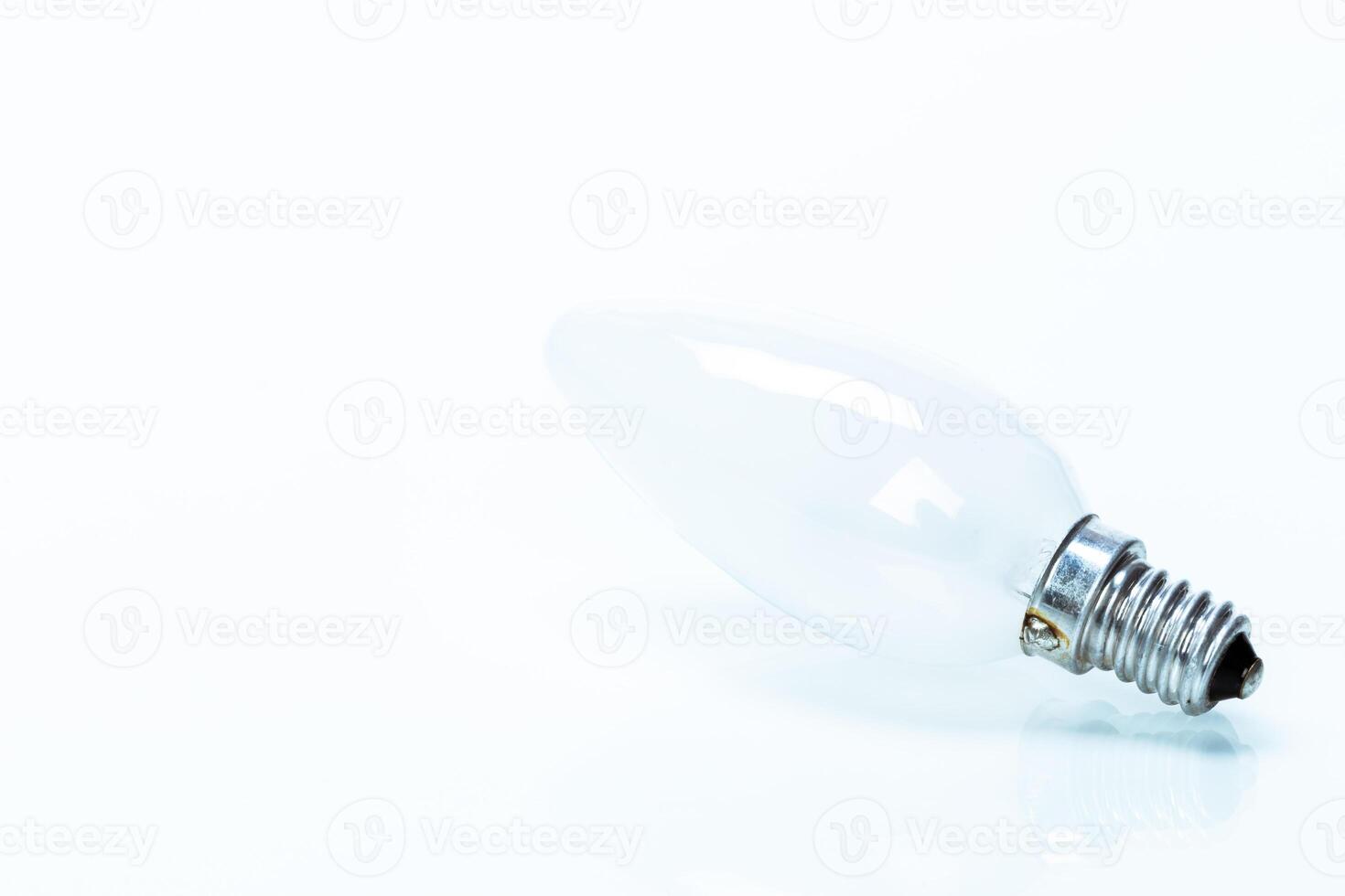 Close up of a light bulb on white background photo