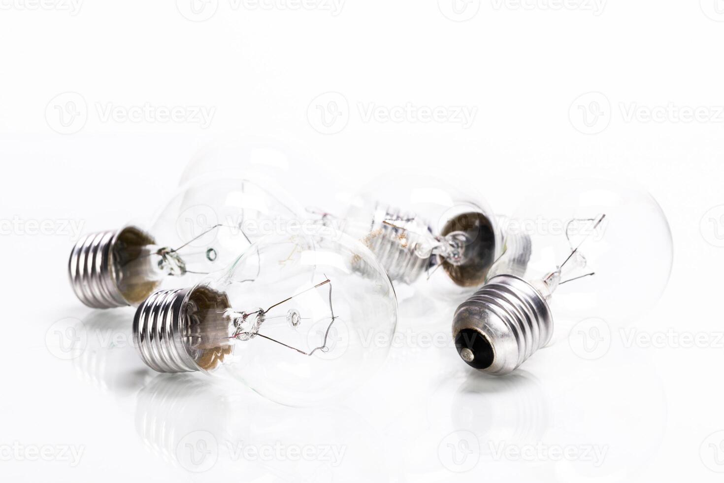 Many lightbulbs on white background close up photo
