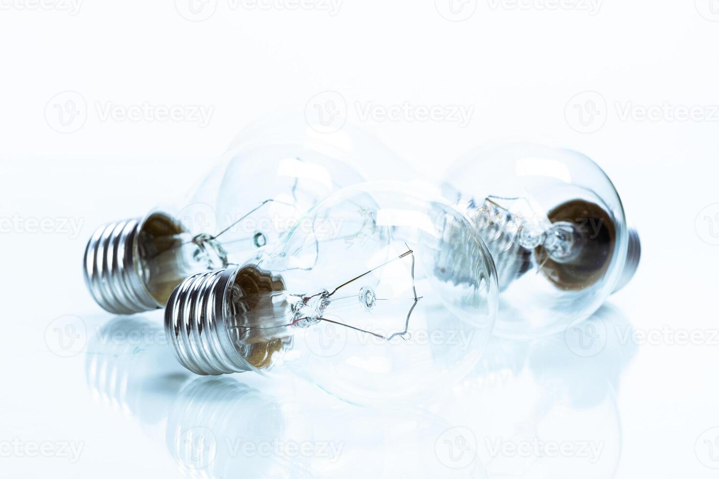 Many lightbulbs on white background close up photo
