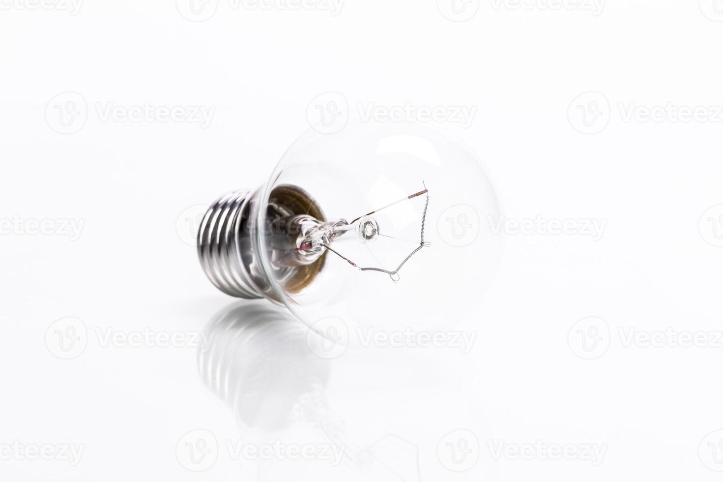 Close up of a light bulb on white background photo