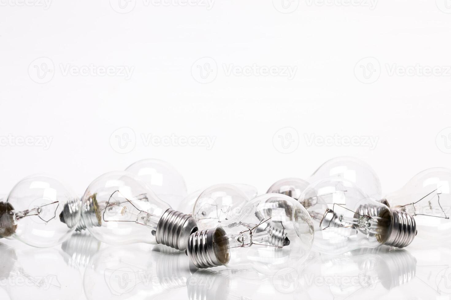 Many lightbulbs on white background close up photo