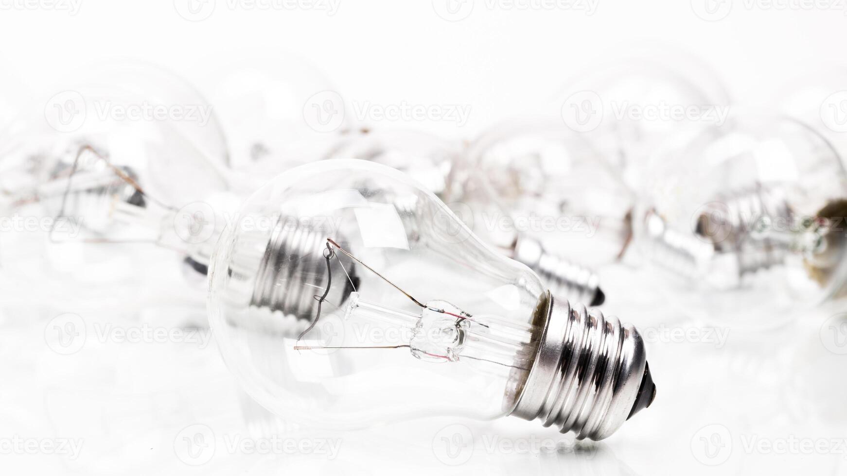 Many lightbulbs on white background close up photo