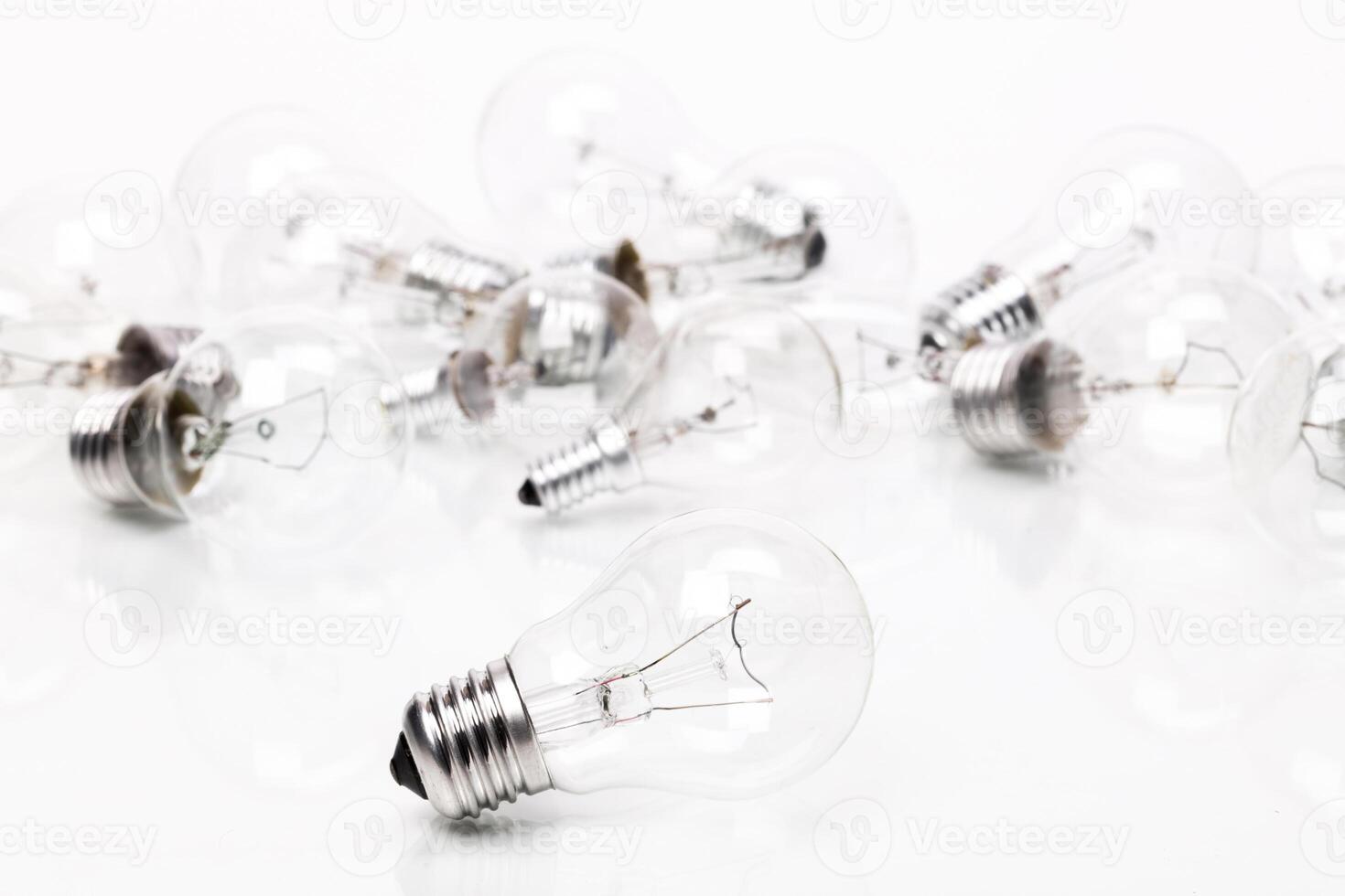 Many lightbulbs on white background close up photo