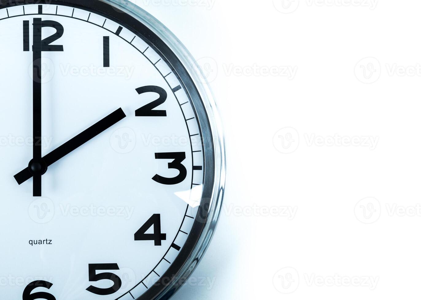 Close up of a wall clock. Time management concept photo