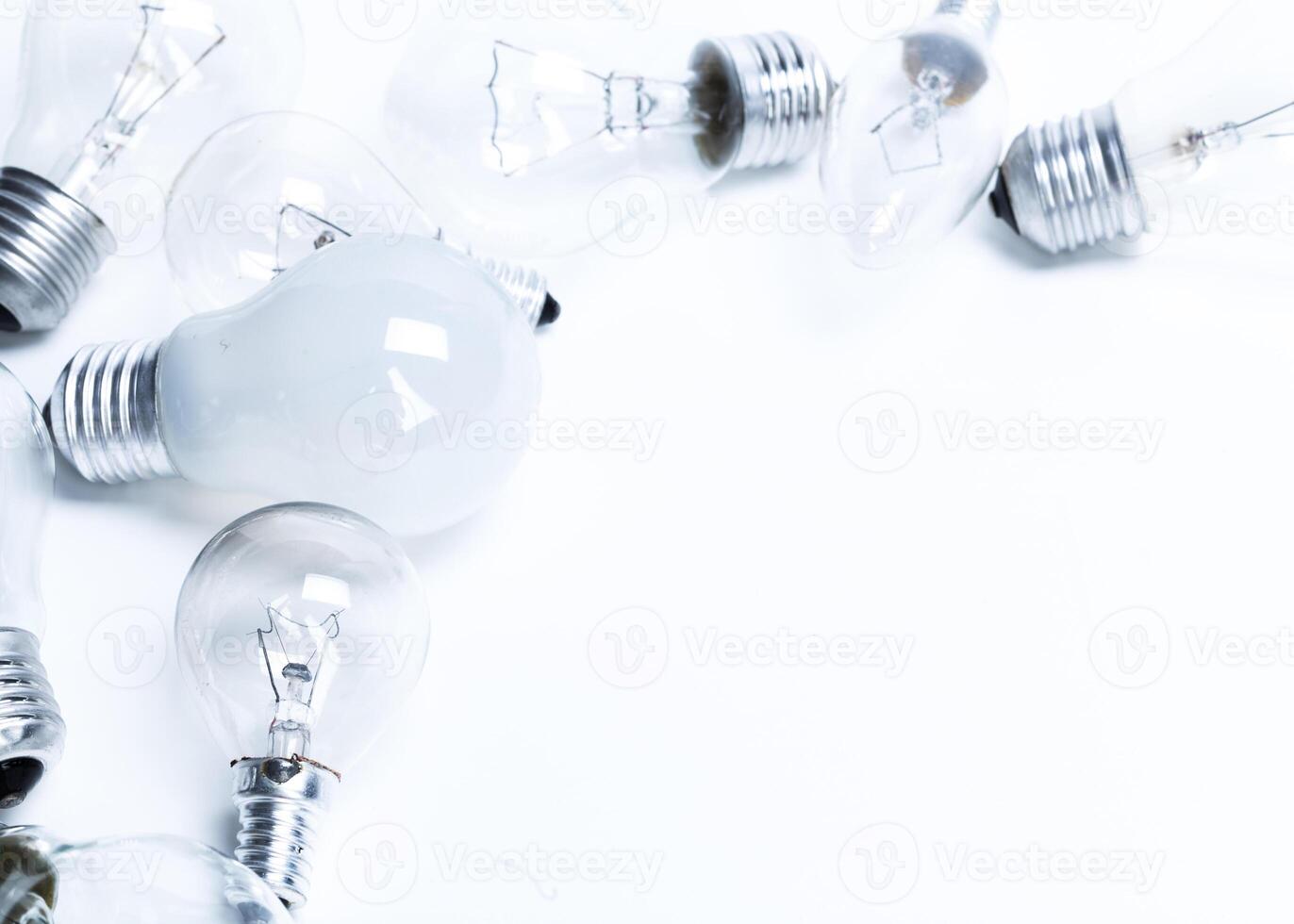 Many lightbulbs on white background close up photo