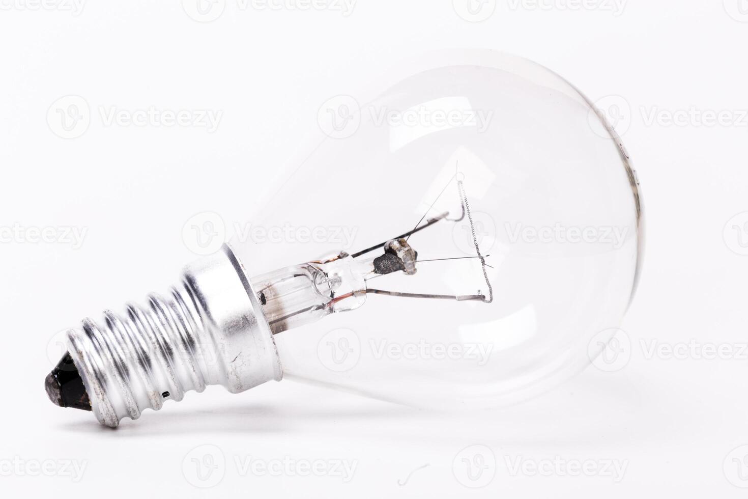 Close up of a light bulb on white background photo
