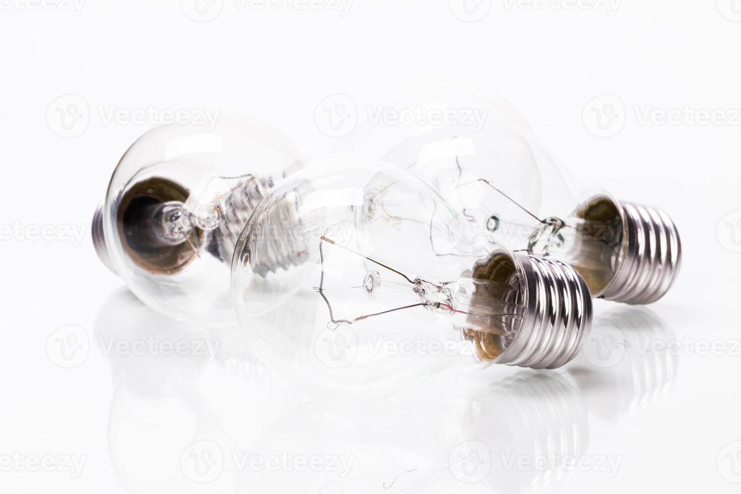 Many lightbulbs on white background close up photo