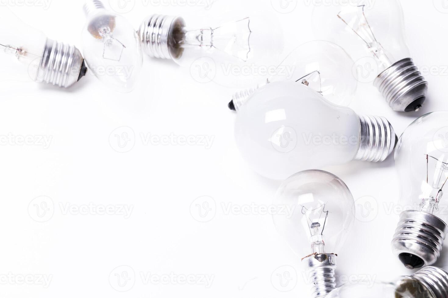 Many lightbulbs on white background close up photo