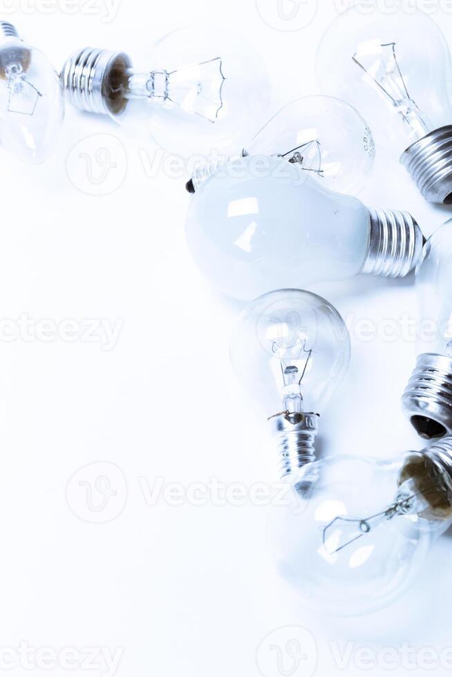Many lightbulbs on white background close up photo