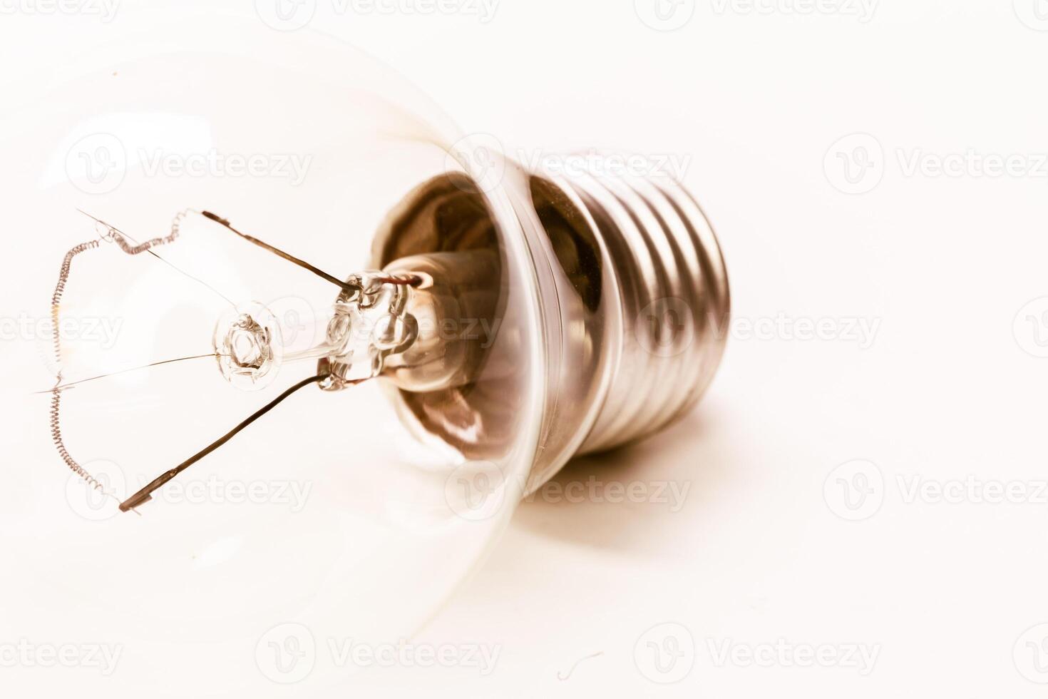 Close up of a light bulb on white background photo