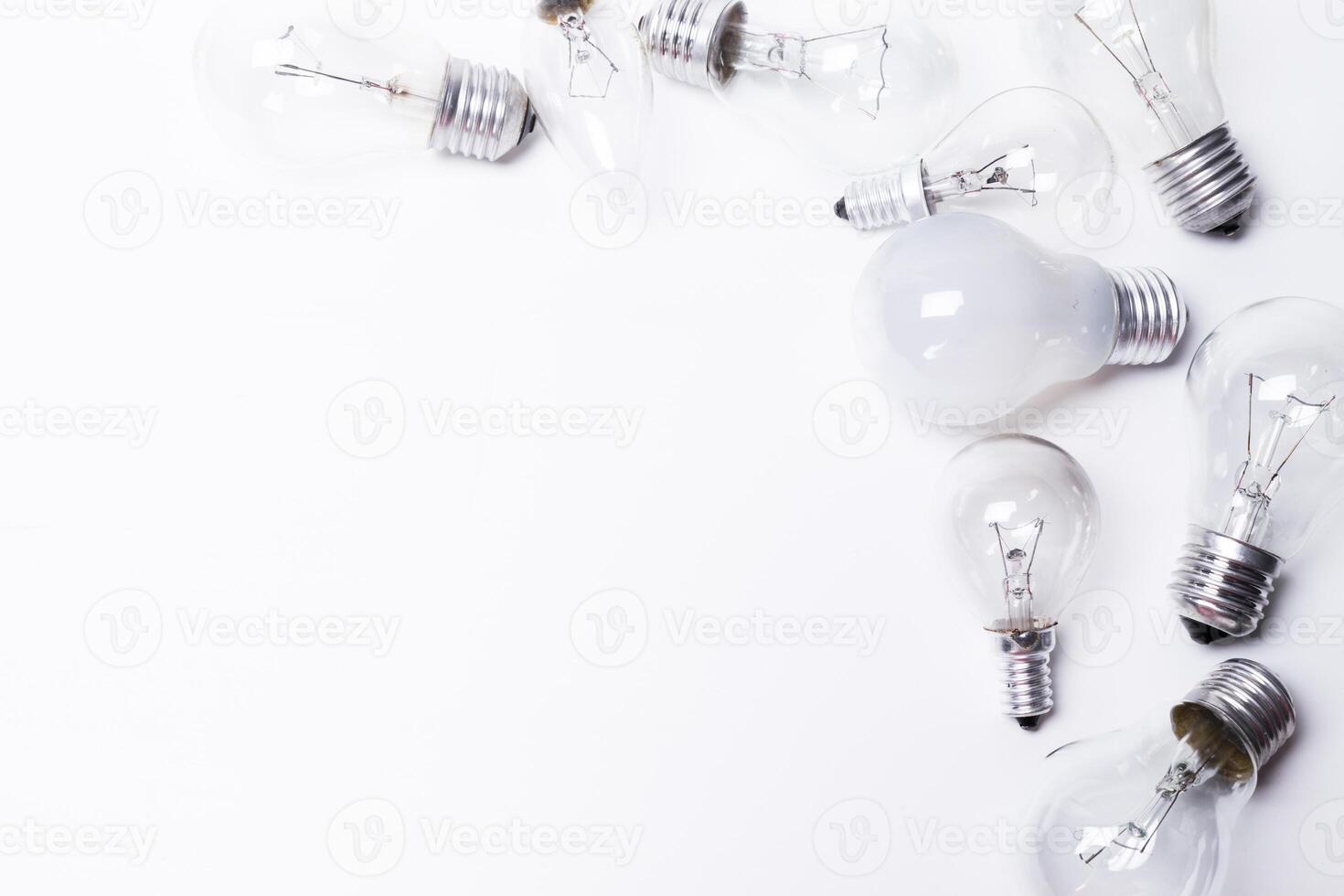 Many lightbulbs on white background close up photo