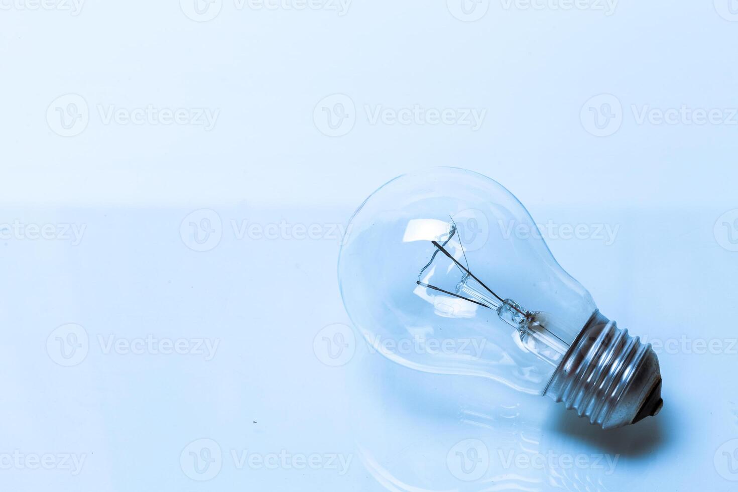 Close up of a light bulb on white background photo