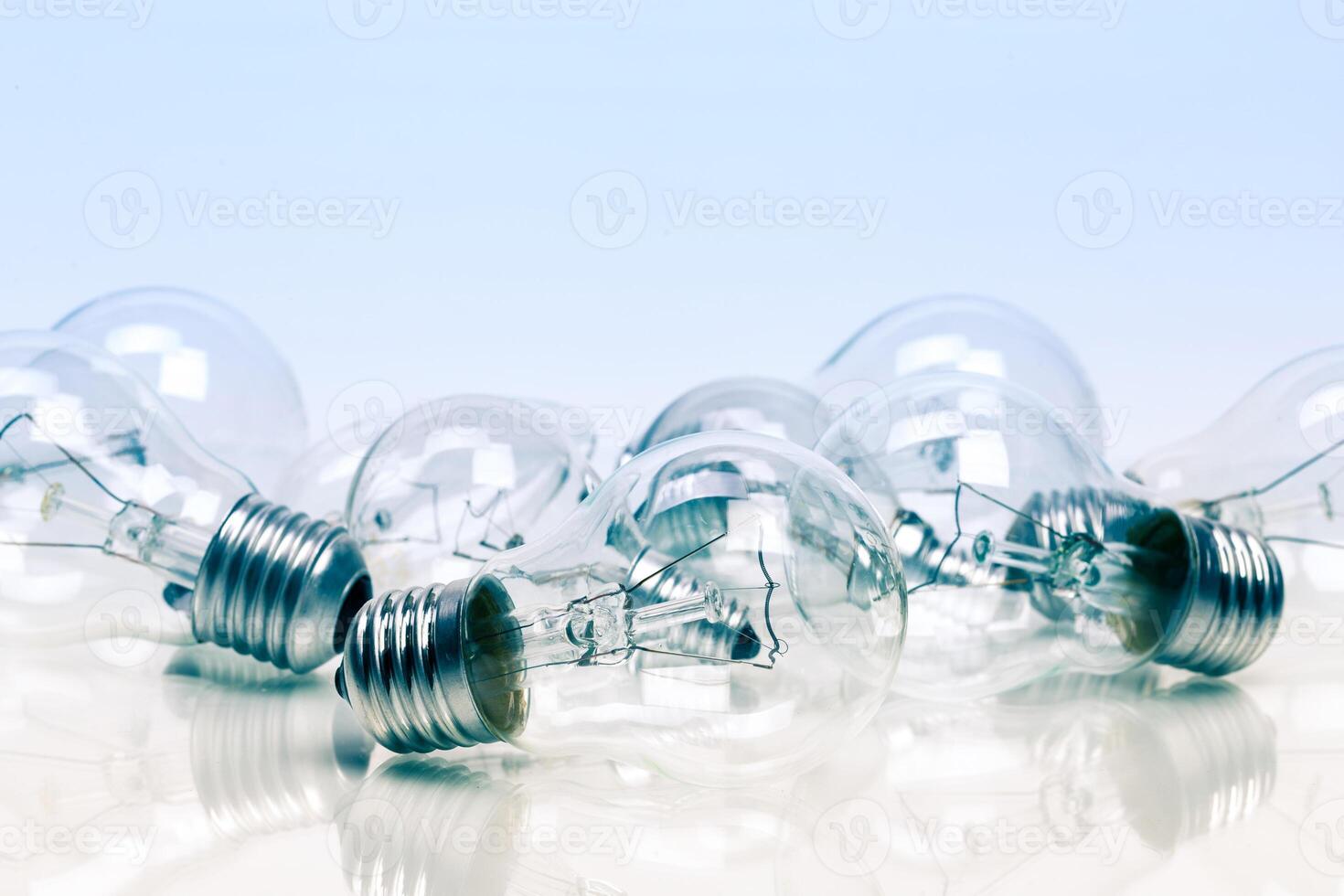 Many lightbulbs on white background close up photo