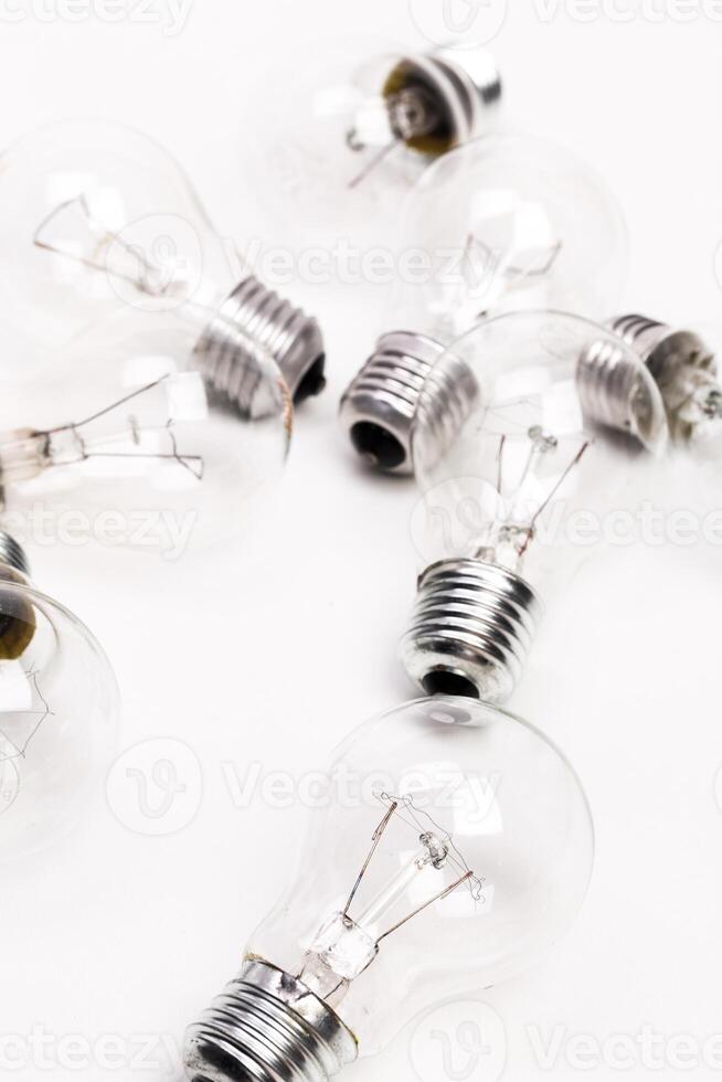 Many lightbulbs on white background close up photo