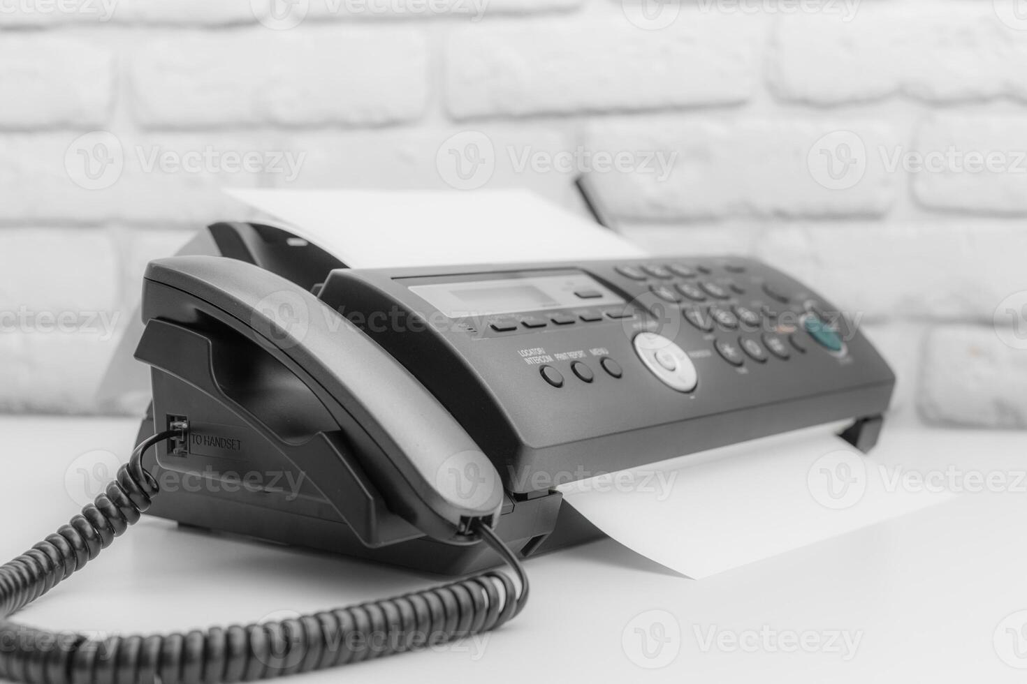 Fax machine, office equipment on white table photo